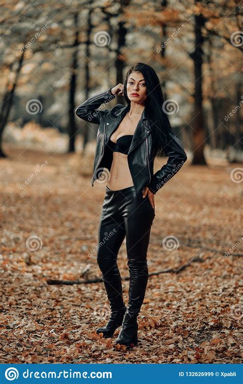 Beautiful Dark Haired Young Woman Wearing A Black Bra Leather Jacket