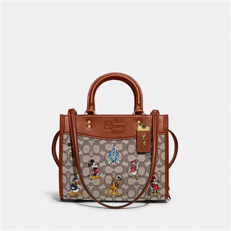 Coach Outlet Disney X Coach Rogue Bag In Signature Textile