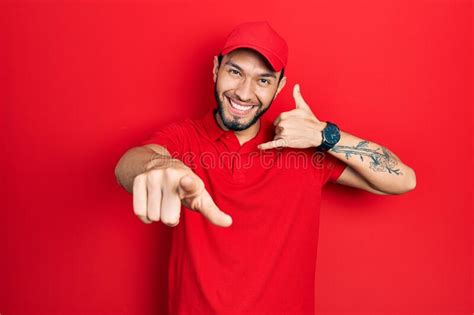 Hispanic Man With Beard Wearing Delivery Uniform And Cap Smiling Doing