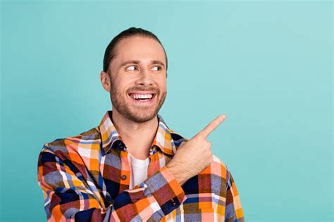 Photo Of Positive Man With Long Hairstyle Dressed Checkered Shirt Look Directing At Offer Empty