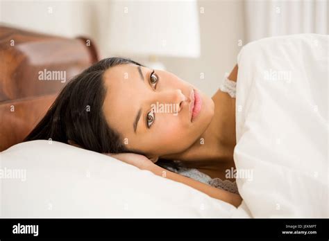 Attractive Brunette On Bed Stock Photo Alamy
