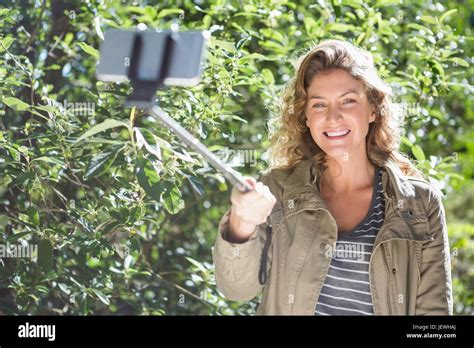 Smiling Woman Taking Selfies Stock Photo Alamy