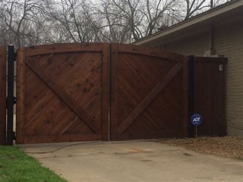 Double Swing Wood Auto Gate Built By Titan Fence And Supply Company Custom Gates Double Swing