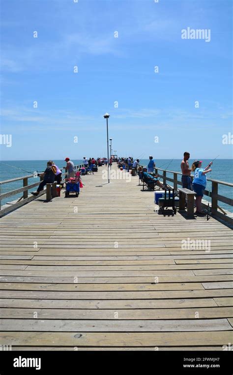 Fishermen Line The Kure Beach Pier In North Carolina Stock Photo Alamy