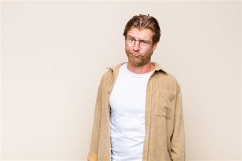 Premium Photo Blonde Adult Blonde Man Wearing Glasses Isolated