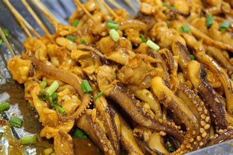 Squid With Scallion On Iron Plate Background Squid Teppanyaki