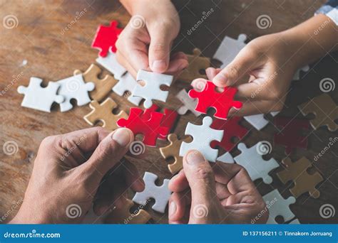 Business People Holding Jigsaw Puzzle Group Of Business People Using A