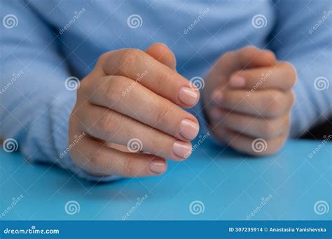 Stylish Nude Beige Female Nails On Blue Background Modern Trendy Stylish Beautiful Manicure