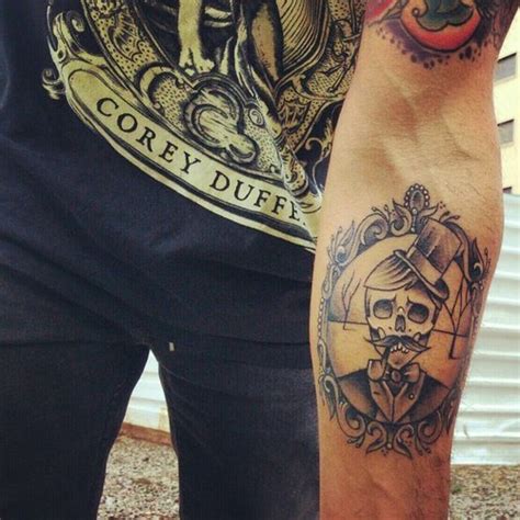 Skull forearm tattoo