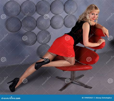 Blonde Model In Stockings And Red Miniskirt Posing In Studio Stock Image Image Of Blonde