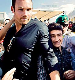 Damn right they're horns, Daniel Radcliffe and his bodyguard Sam.