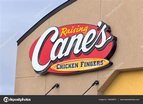 Raising Cane's Chicken Fingers Restaurant Exterior and Logo – Stock ...