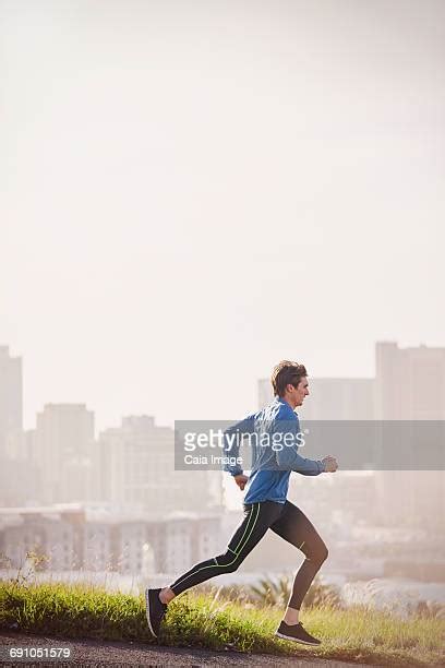 Man Running Down Street Photos And Premium High Res Pictures Getty Images