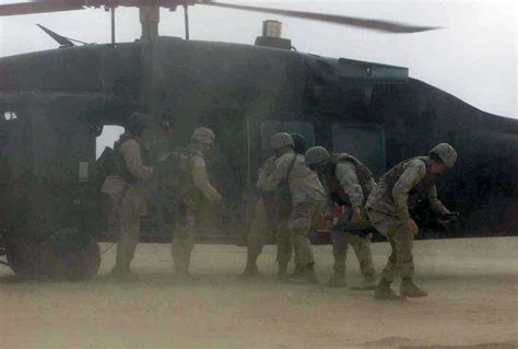 A US Army USA UH 60 Black Hawk Medical Evacuation Helicopter Arrives