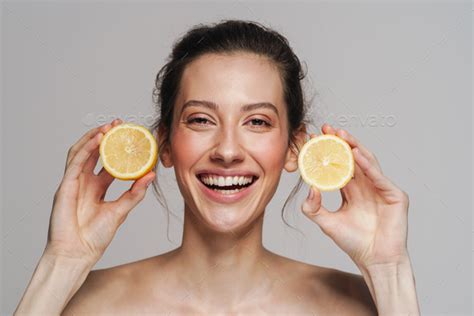 Cheerful Half Naked Woman Laughing While Posing With Lemon Stock Photo