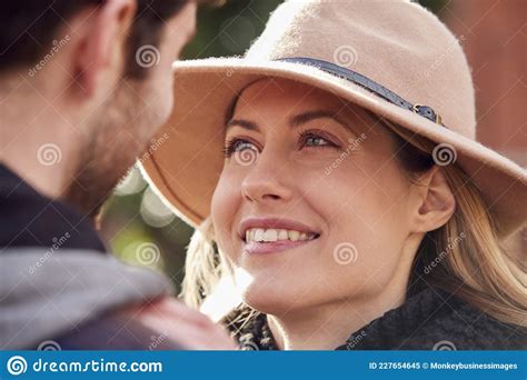 Close Up Of Romantic Couple Hugging On Walk Through Fall Park Together