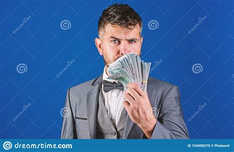 Easy Cash Loans Man Formal Suit Hold Pile Of Dollar Banknotes Blue