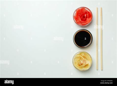 Pickled ginger, soy sauce and chopsticks on white background Stock Photo - Alamy