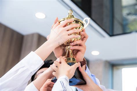 Corporate Team Holding Up The Trophy Picture And HD Photos Free