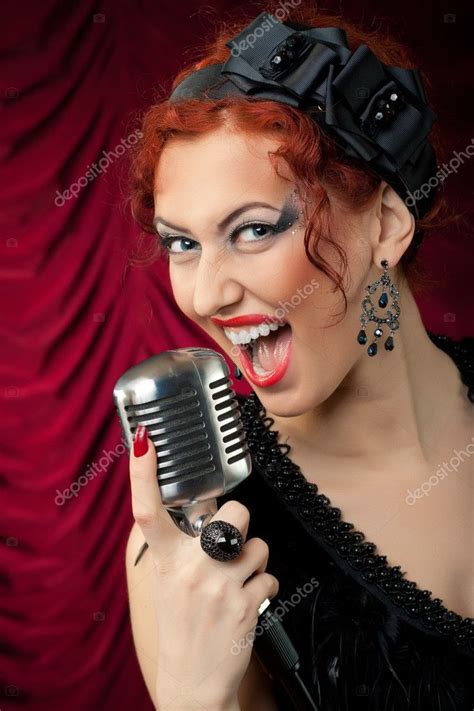 Beautiful Redhead Woman Singing Into Vintage Microphone Stock Photo