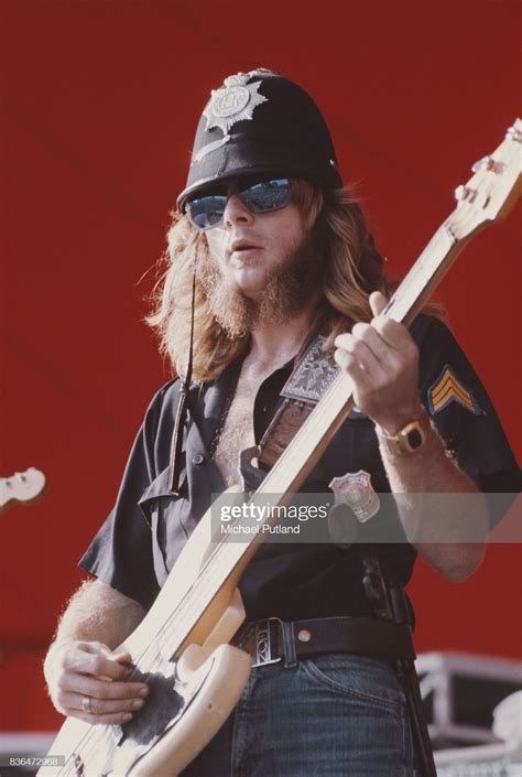 A Man Playing An Electric Guitar On Stage