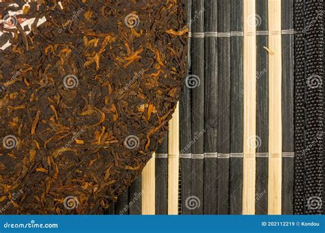 Chinese Pressed PU Erh Tea On Bamboo Mat Close Up Macro Stock Image