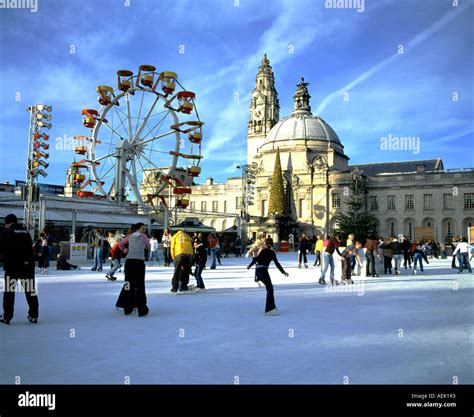 ice skating at cardiff winter wonderland with the city hall in the ...