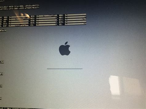 2010 MacBook Pro on endless restart loop, displaying DOS-like text on