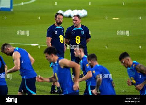 England Manager Gareth Southgate Alongside Assistant Steve Holland During A Training Session At