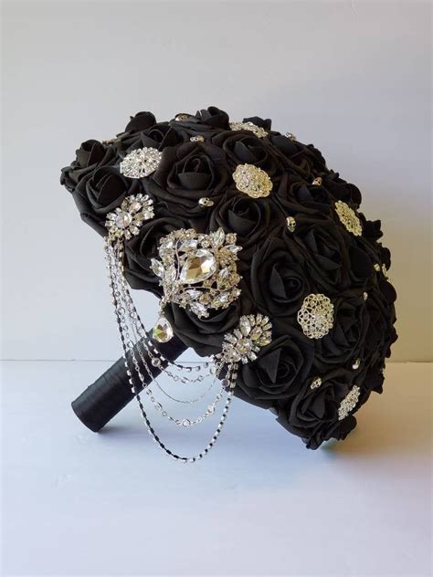 A Bridal Bouquet With Black Roses And Jewels