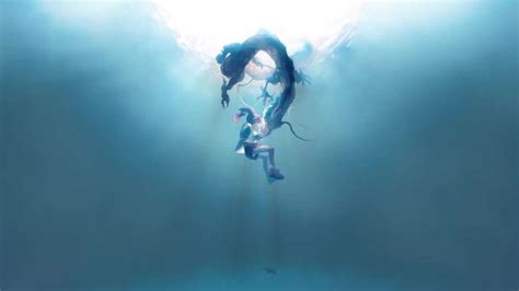 Two People Are Floating In The Water With Their Arms Around Each Other