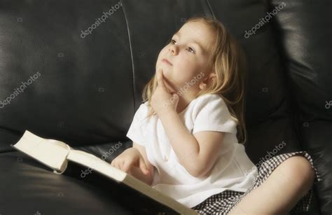 Little Girl Reading — Stock Photo © DesignPicsInc #31618443