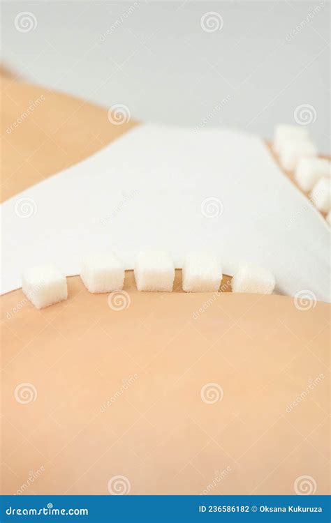 Sugar Cubes Lying In A Row On Female Bikini Zone The Concept Of