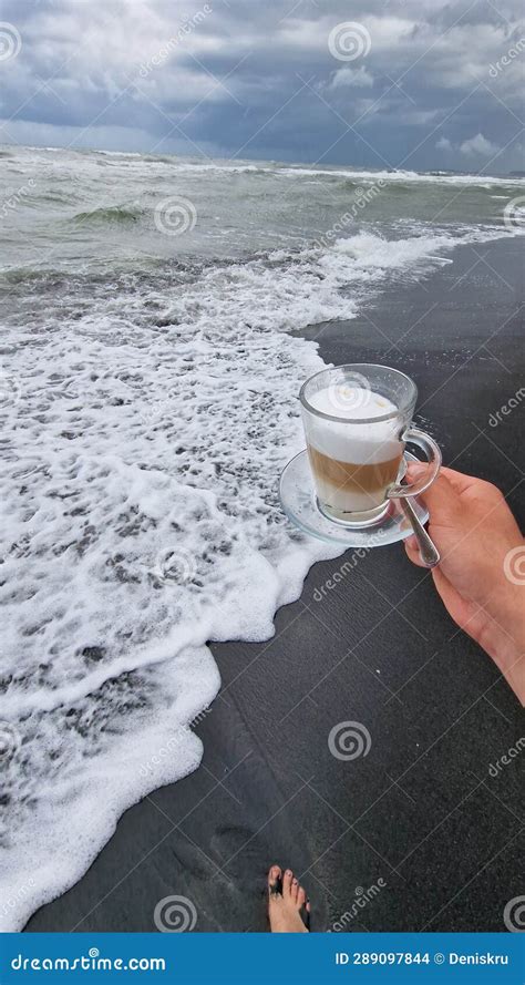 Cup Of Coffee On The Beach Stock Photo Image Of Hand 289097844