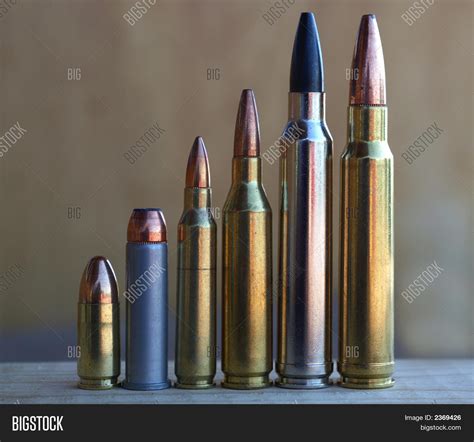 Pistol Rifle Bullets Increasing Image & Photo | Bigstock