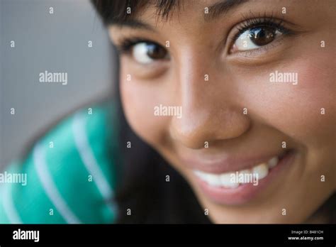 Closeup Of Fifteen Year Old Hispanic Teenager Looking At Camera Girl Woman Latina Latino