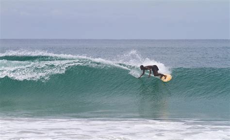 This is pro-surfer Benjamin "Benji" McCrumuda riding a large wave in ...