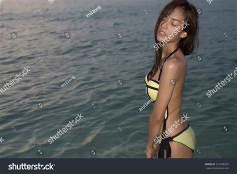 Sexy Asian Woman Yellow Bikini Two Foto Stok 731498305 Shutterstock