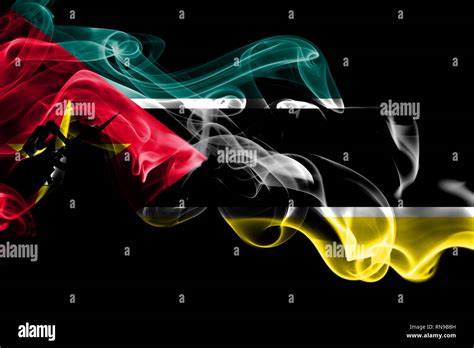 National Flag Of Mozambique Made From Colored Smoke Isolated On Black Background Abstract Silky