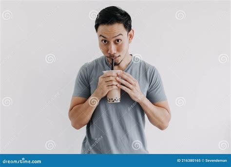 Man Drinking Boba Tea Or Bubble Tea Deliciously Isolated On White