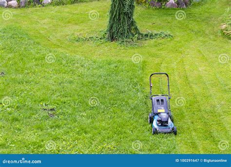 Mowing Lawns. Lawn Mower on Green Grass. Mower Grass Equipment Stock Image - Image of equipment ...