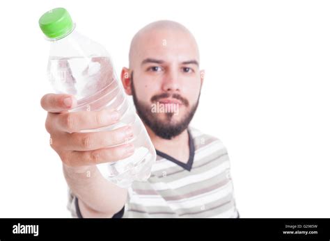 Man Offering A Plastic Bottle Of Cold Water For Hydration During Summer