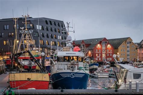 Tromso harbour in winter editorial photo. Image of evening - 153236891