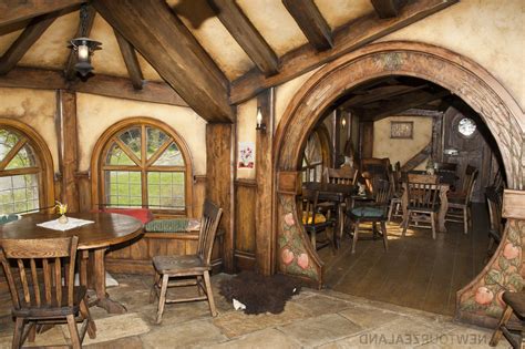 Cozy Hobbit House Interior with Wood Furniture and Arched Doorways