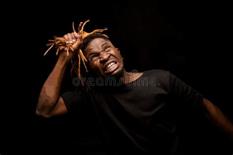 Naked Black Guy With Blonde Dreadlocks Posing In The Studio Looking At Camera Stock Image