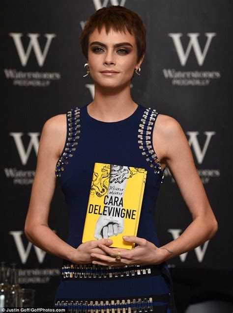 Cara Delevingne is chic as she promotes her debut novel in London ...