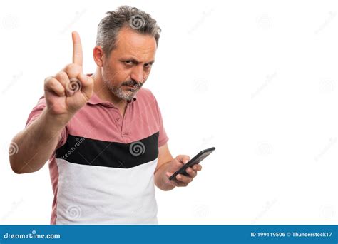 Male Model Making Wait Gesture Using Index Finger While Texting Stock