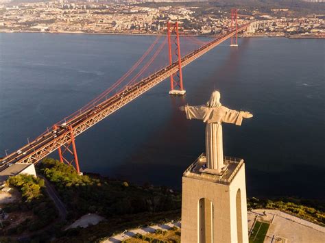 Aerial View Of The Cristo Rei Statue Looking Over The Tajo River Onto