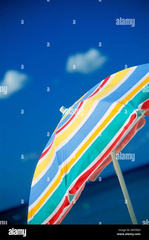 Hawaii Upward View Of Colorful Beach Umbrella With Sky In Background