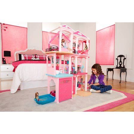 Barbie Dollhouse, Dreamhouse / The built-in garage has a door that ...